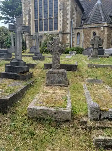 Solar cross on a tombstone in cemetery, London